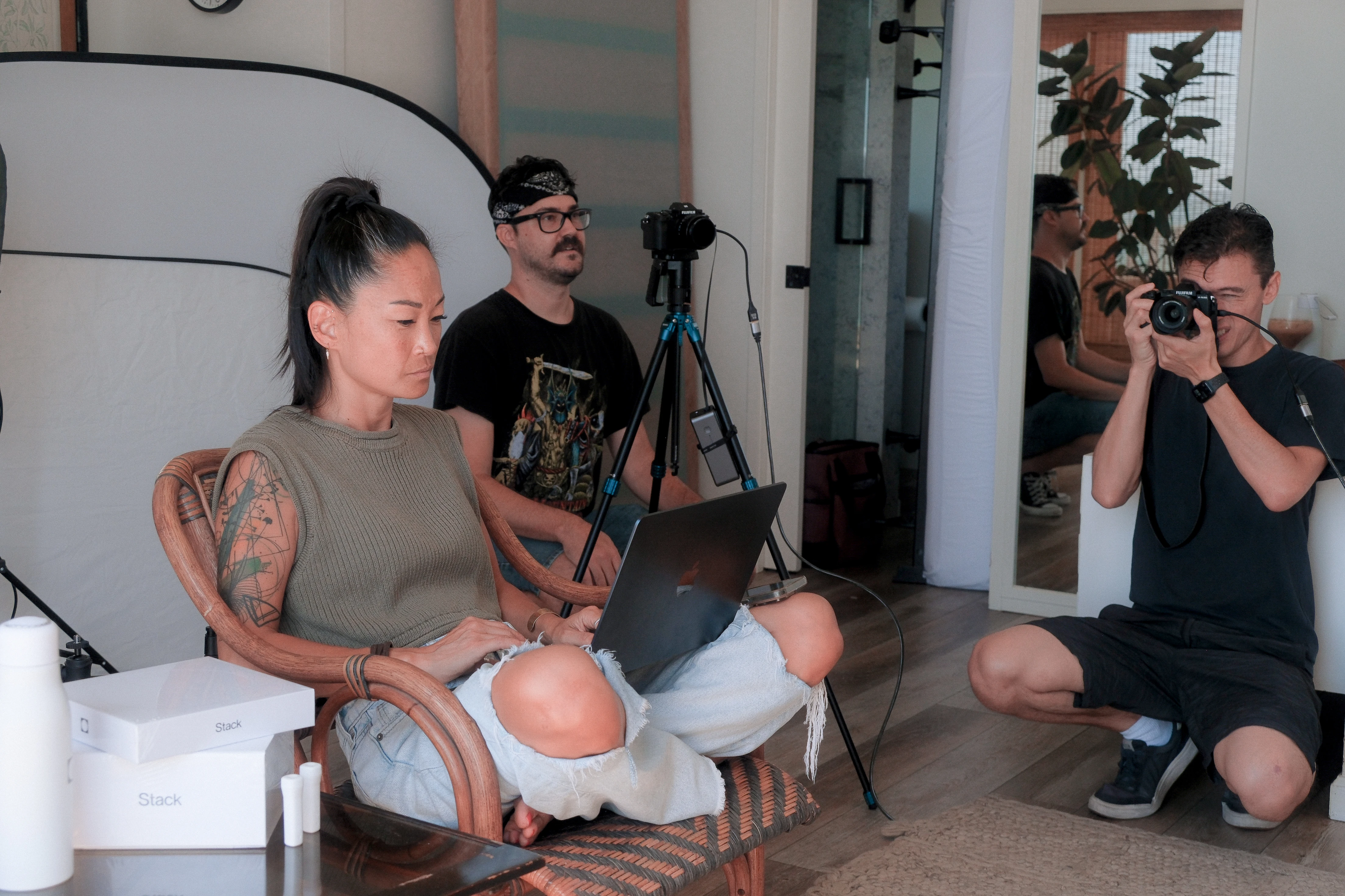 The crew reviewing footage on set: Sindee Savage, Dan Grady, and Ben Carthel