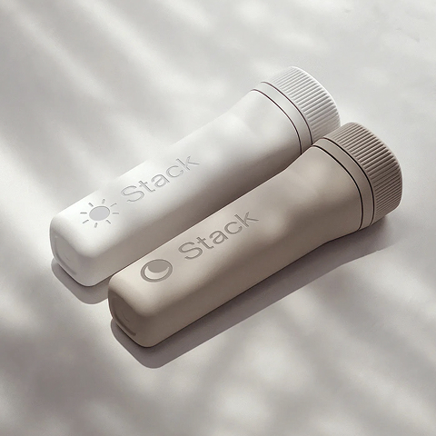 Man putting a capusle of Stack into his bag.